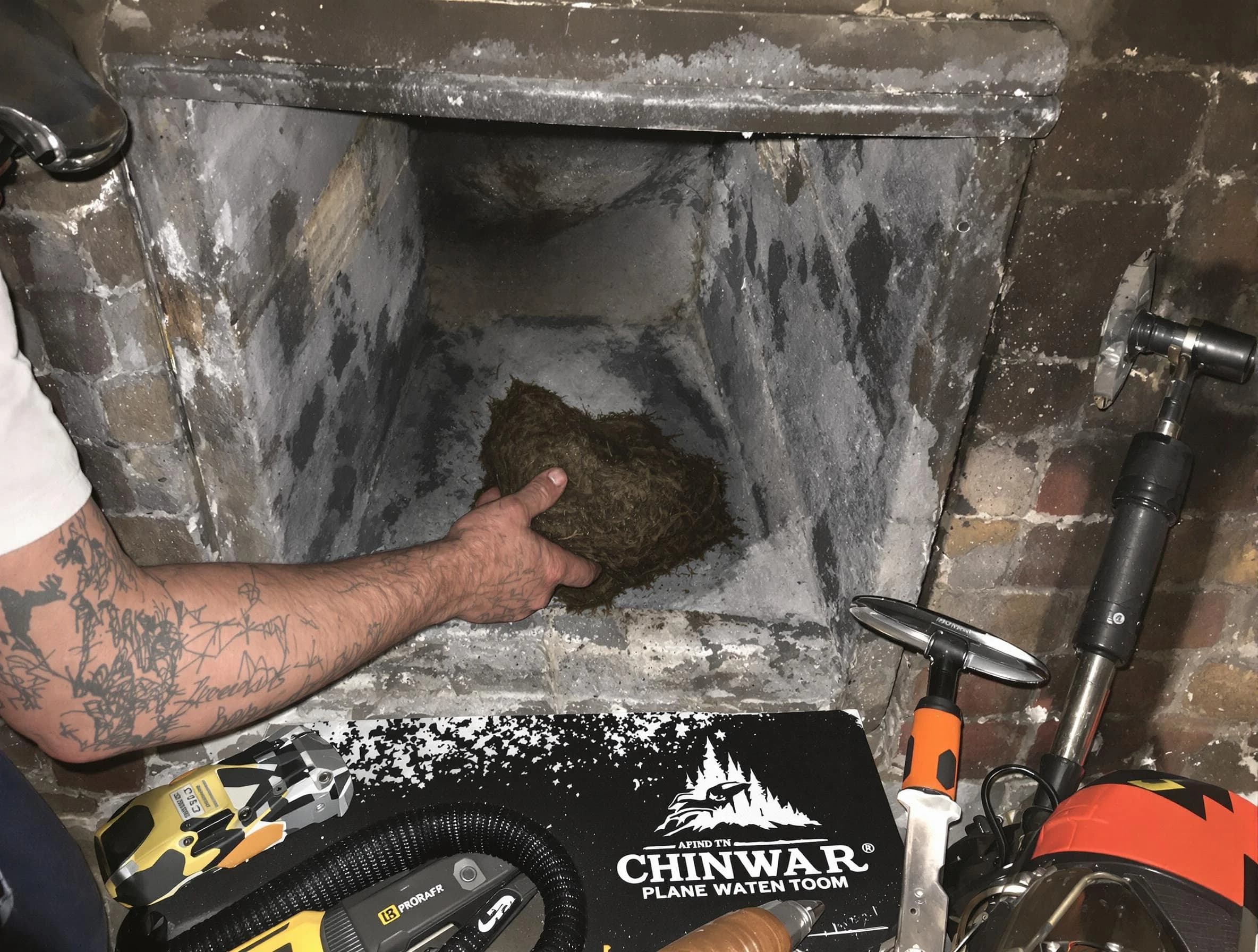 Cranston Chimney Sweep safely removing debris and screening chimney in Cranston, RI